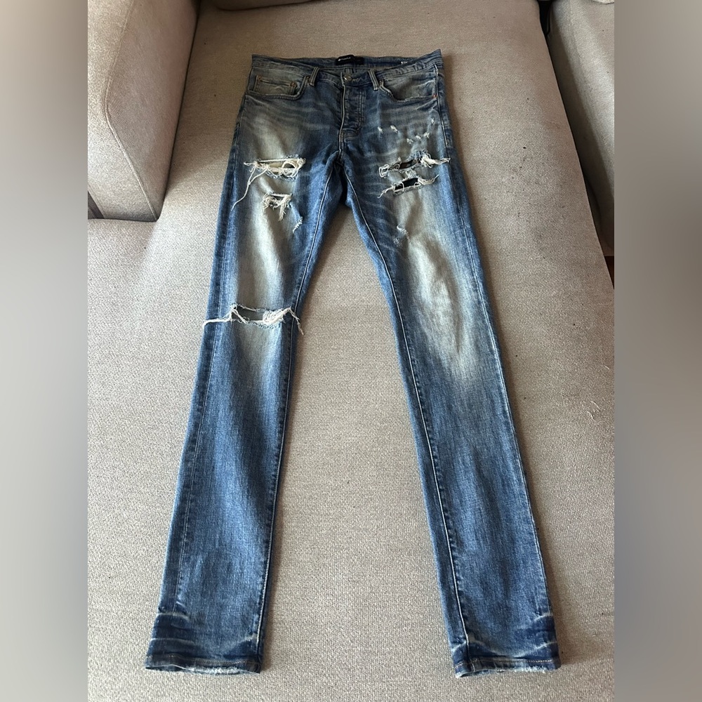 Distressed Purple brand jeans.